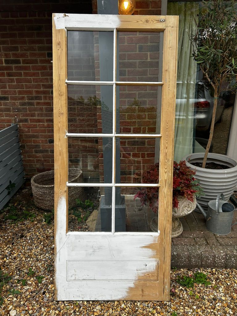 	Exterior panelled door refurbished and repainted on a brick house