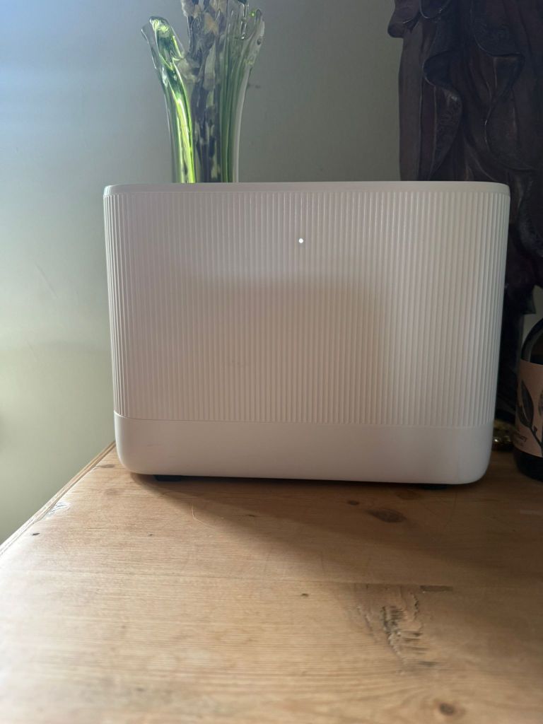 Broadband Wi-Fi router set up and installed on a wooden desk